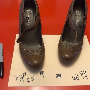 Light brow Mary Janes with a metal stud detail. Please note size difference.